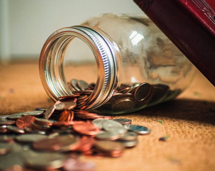 image of coins that have fallen out of old mason jar