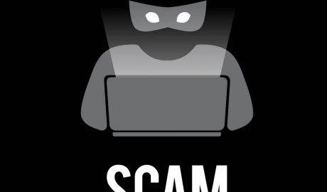 Graphic of criminal on computer with word SCAM