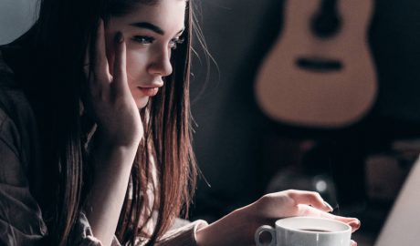 young professional woman looking at computer