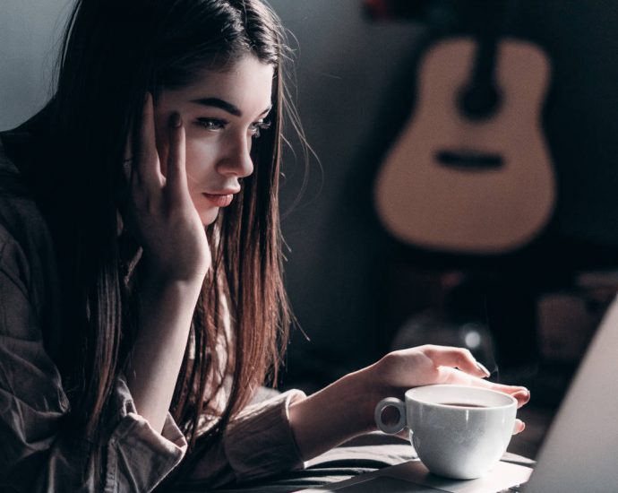 young professional woman looking at computer