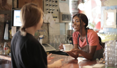 young girl serving coffee