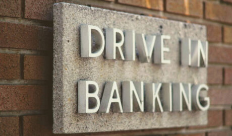 sign on brick wall: Drive In Banking