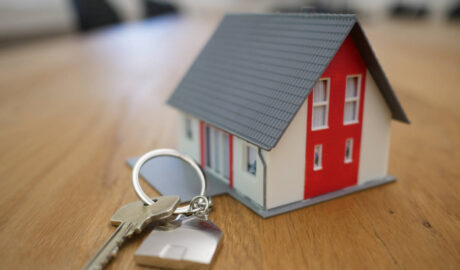 model house with normal housekey next to it