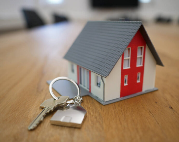 model house with normal housekey next to it