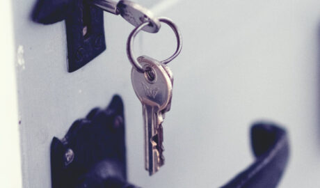 keys in a lock above a door handle