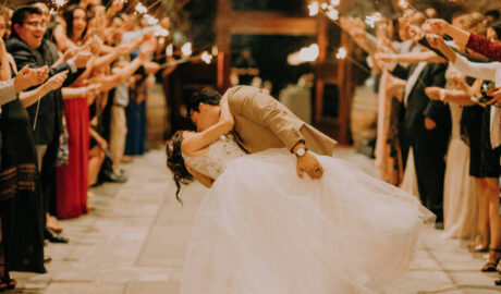 husband kissing bride during dance