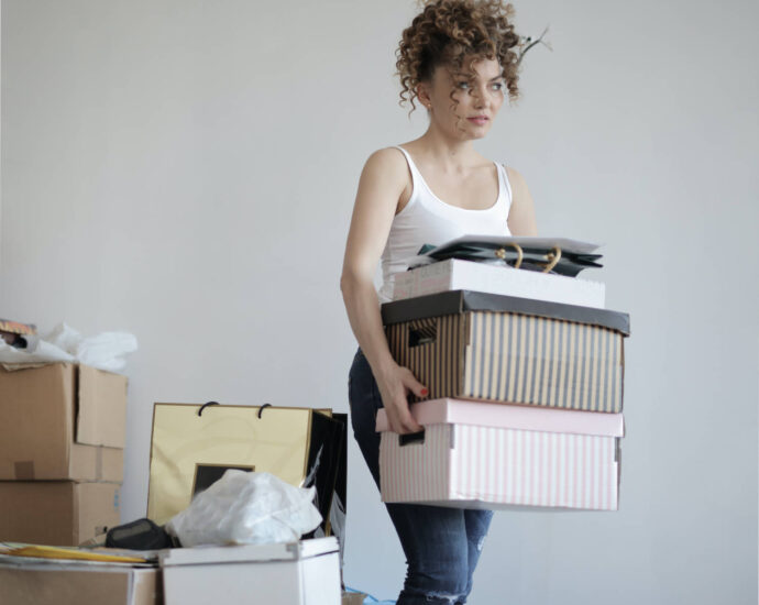 young woman moving boxes