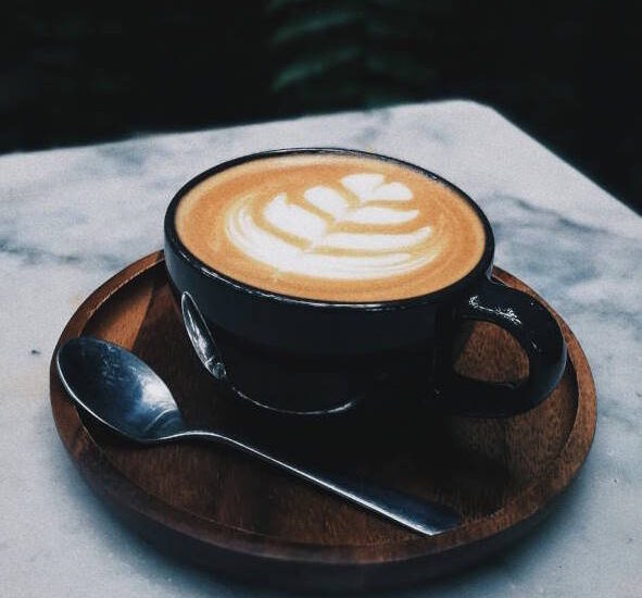 cup of coffee with leaf design