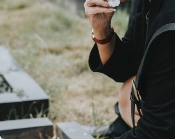 woman mourning at gravesite